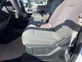 A 2019 Ford F-350 SD front seat view showing grey fabric upholstery with adjustable seat controls