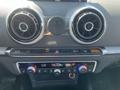 Dashboard of a 2016 Audi A3 featuring climate control knobs and air vents