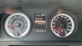 Dashboard of a 2013 RAM 2500 showing speedometer fuel economy and vehicle information with dials for RPM and speed