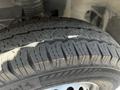 Close-up of a tire with a detailed tread pattern mounted on a 2022 Mercedes-Benz Sprinter