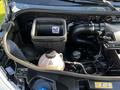 2021 Mercedes-Benz Sprinter engine compartment showing the air filter box and coolant reservoir with visible labels and warning symbols