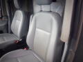 Two gray leather seats in a 2015 Ford Transit van interior