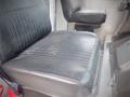 A black leather seat with horizontal lines designed for a Freightliner MT45 Chassis interior