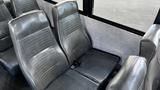 Interior seating of a 2014 Freightliner Thomas Bus Diesel featuring gray vinyl seats designed for passenger comfort