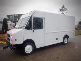 White 2003 Freightliner MT45 Chassis delivery truck with no visible branding and a boxy design