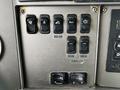 Control panel of a 2014 Kenworth T370 featuring various switches labeled for rear box side and lights