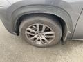 A close-up view of a tire and alloy wheel from a 2021 Lexus NX 300 showing a Continental tire with visible dirt and scratches on the wheel rim