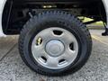 Close-up of a Kumho Roadventure tire mounted on a silver wheel of a 2008 Ford F-150 XL