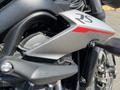 Close-up of a 2018 Triumph Street Triple RS showing the silver bodywork with red accents and the engine components detailing