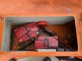 A 2008 Fassmer 20 Foot Fast Rescue boat battery compartment containing red batteries and electrical connections