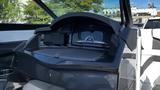 Interior view of a 2023 Mercury Monterey dashboard featuring a sleek design with storage compartments and modern controls