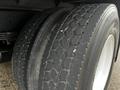 Close-up of the dual tires of a 2020 Hino 338 displaying a textured tread pattern and visible wear on the rubber surfaces