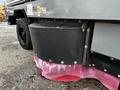 A 2007 Tennant Sentinel floor scrubber with a black water tank and red squeegee attachment at the bottom