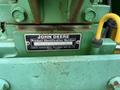 A metal nameplate attached to a 2003 John Deere 790 tractor displaying the product identification number and manufacturer details