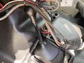 Close-up of the gear shift lever and exposed wiring in the interior of a 2010 Ford F-550