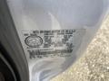 A manufacturing label on a 2000 Ford F-350 SD with details including gross vehicle weight and tire specifications