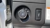 Image showing the control panel of a 2011 Ford F-450 SD featuring the headlight and fog light switches along with an indicator for vehicle lighting settings