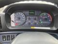Dashboard display of a 2008 Hino Conventional Cab showing speedometer fuel gauge and various indicator lights
