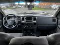 Interior view of a 2008 Dodge Ram 5500 featuring a steering wheel dashboard and center console with various controls and gauges