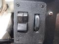 Close-up of two switches and a dial on the dashboard of a 2007 Morgan Olson Workhorse W42 vehicle