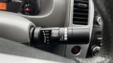 Close-up of the windshield wiper control stalk in a 2016 Nissan Frontier showing various settings for mist and intermittent wipers