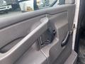 The interior door handle of a 2017 Chevrolet Express featuring a gray plastic design and a black pull lever