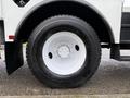 Side view of a white tire mounted on a black steel wheel for a 2007 International 4200 truck