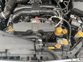 2014 Subaru Impreza engine with visible components including the air intake manifold battery and coolant reservoir