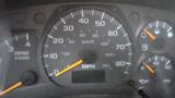 Dashboard of a 2008 Chevrolet C7500 showing speedometer with MPH and km/h markings along with RPM gauge and fuel level indicator