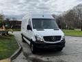 A white 2016 Mercedes-Benz Sprinter van parked with headlights on and a solid front design featuring the Mercedes logo prominently on the grille