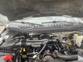 Engine compartment of a 2017 Ford F-550 showing the engine assembly and various components including hoses and wires