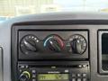 Control panel with knobs for climate and airflow adjustment and a radio display showing the time 3:25 PM