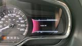 The dashboard of a 2013 Lincoln MKT displaying the speedometer and entertainment menu with a message indicating audio is off