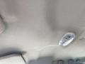 Interior view of the roof of a 2010 Ford F-550 showing a light fixture and the textured ceiling material