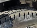 Close-up of a tire from a 2021 Mercedes-Benz Sprinter showcasing detailed tread patterns and the sidewall design