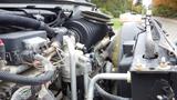 Close-up view of the engine compartment of a 2008 Chevrolet C7500 featuring various mechanical components and wiring details