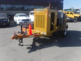 2006 O'Brien 3515-CF Trailer Jetter with a yellow exterior featuring a large engine compartment and red traffic cone attached to the front