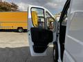 A 2019 RAM Promaster van with its front door open displaying the interior space