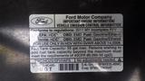 2011 Ford Econoline vehicle emission control information label detailing engine specifications and fuel tank capacity