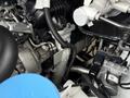 A close-up view of the engine components of a 2019 Mercedes-Benz Sprinter showing various pipes wires and mechanical parts