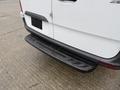 Rear view of a 2019 Mercedes-Benz Sprinter with a black bumper and cargo door handle