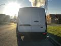 A 2022 Ford Transit Connect viewed from the rear with a white body and a black rear bumper showing no license plate