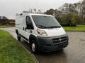 A 2018 RAM Promaster van with a white exterior and various mounted equipment on the roof