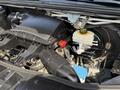 2019 Mercedes-Benz Sprinter engine bay showing components like the air intake cover coolant reservoir and brake fluid reservoir