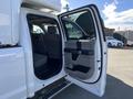 A 2019 Ford F-350 SD with an open passenger door revealing the interior and seating area