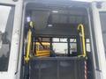 Interior view of a 2017 Chevrolet Express showing a wheelchair ramp and seating area with overhead lights