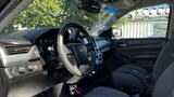 Interior view of a 2018 Chevrolet Tahoe showcasing the steering wheel dashboard and front seats with a modern design and controls