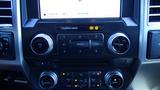 Dashboard of a 2017 Ford F-350 SD featuring audio and climate control knobs and a touchscreen display