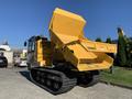 A yellow 2022 TerraMac RT7R dump truck with a large open bin on tracks designed for off-road mobility and heavy loads