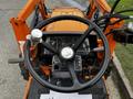 Aerial view of the steering wheel and dashboard of a 2001 Agco ST40 tractor showcasing various controls and gauges